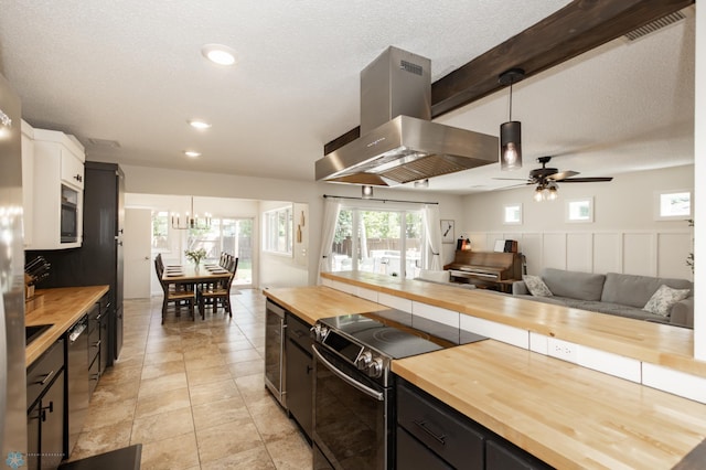 25 Birch Ln S, Fargo, ND 58103 - kitchen with butcher block counters, electric stove, exhaust hood, pendant lighting, and recessed lighting