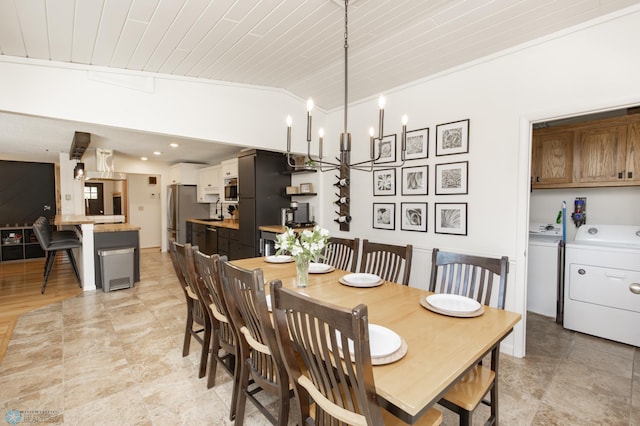 25 Birch Ln S, Fargo, ND 58103 - dining room featuring independent washer and dryer, lofted ceiling, wooden ceiling, and a chandelier