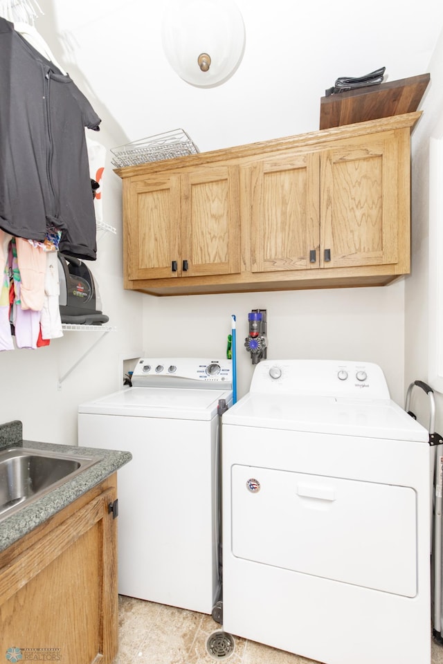 25 Birch Ln S, Fargo, ND 58103 - washroom featuring independent washer and dryer and cabinet space