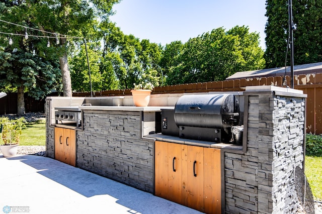 25 Birch Ln S, Fargo, ND 58103 - view of patio featuring exterior kitchen
