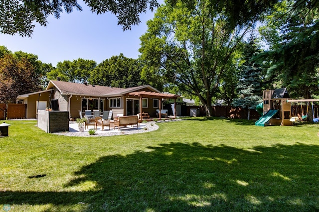 25 Birch Ln S, Fargo, ND 58103 - rear view of property with a patio, a fenced backyard, and a playground