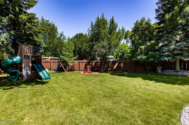 25 Birch Ln S, Fargo, ND 58103 - fenced backyard with a playground