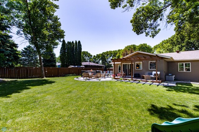 25 Birch Ln S, Fargo, ND 58103 - view of yard featuring outdoor lounge area, a patio, and a playground