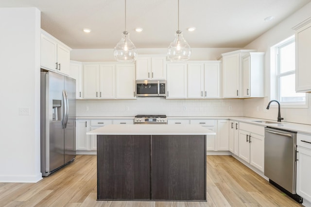 8362 Lander Ave NE, Otsego, MN 55330 - kitchen featuring stainless steel appliances, white cabinetry, light countertops, light wood finished floors, and recessed lighting