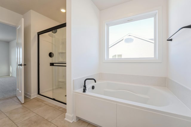 8362 Lander Ave NE, Otsego, MN 55330 - bathroom with a garden tub, a shower stall, and tile patterned floors