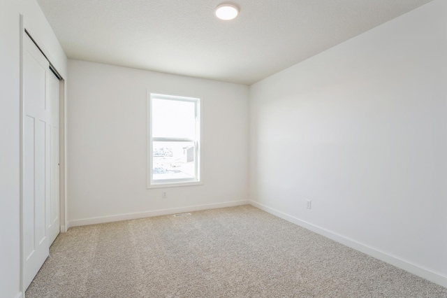 8362 Lander Ave NE, Otsego, MN 55330 - unfurnished bedroom with light colored carpet and a closet