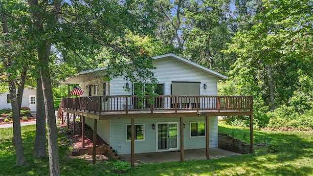 13384 Barnett Rd SW, Sylvan Twp, MN 56473 - back of property with a wooden deck, a patio area, a yard, and stairway