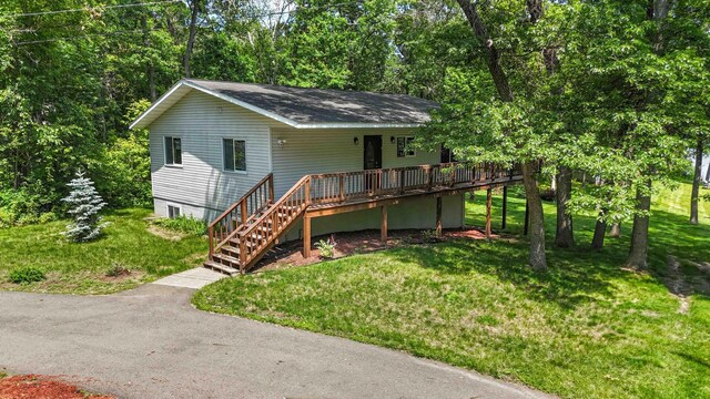 13384 Barnett Rd SW, Sylvan Twp, MN 56473 - single story home featuring a front yard, stairway, and a wooden deck