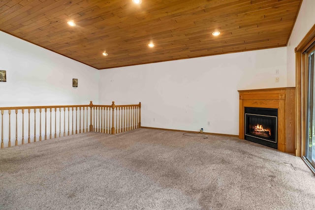 13384 Barnett Rd SW, Sylvan Twp, MN 56473 - unfurnished living room with carpet flooring, wooden ceiling, a glass covered fireplace, and recessed lighting