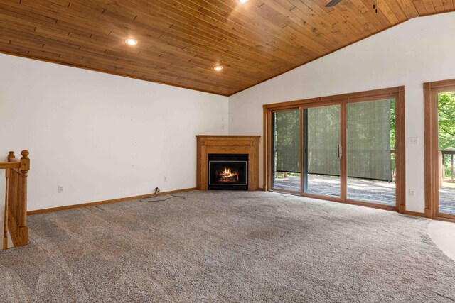 13384 Barnett Rd SW, Sylvan Twp, MN 56473 - unfurnished living room with lofted ceiling, wood ceiling, carpet floors, a lit fireplace, and recessed lighting