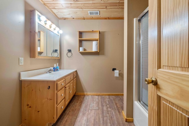 13384 Barnett Rd SW, Sylvan Twp, MN 56473 - full bath with vanity, wood-type flooring, wooden ceiling, and combined bath / shower with glass door