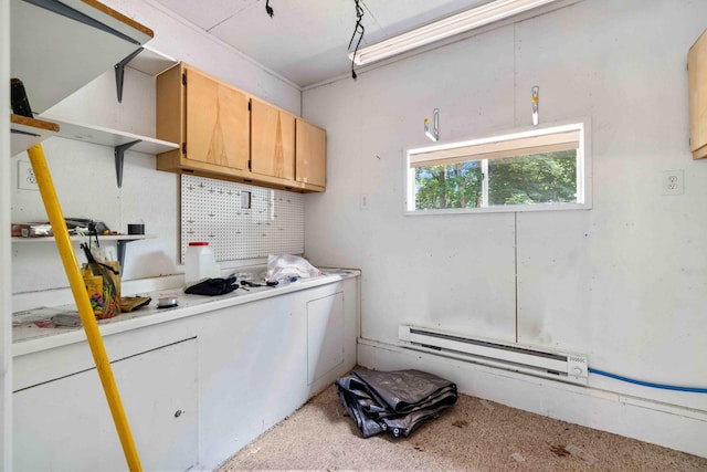 13384 Barnett Rd SW, Sylvan Twp, MN 56473 - kitchen featuring a baseboard radiator and light countertops