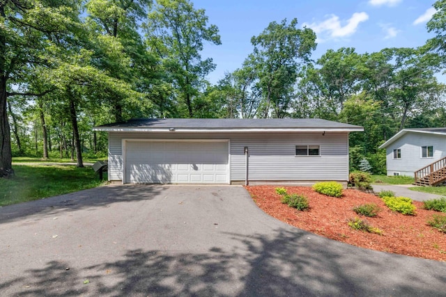 13384 Barnett Rd SW, Sylvan Twp, MN 56473 - garage featuring asphalt driveway