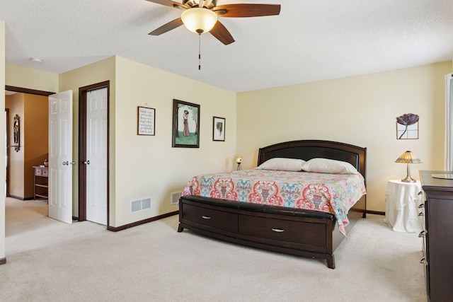 5214 Scott Ct, Robbinsdale, MN 55422 - bedroom featuring light colored carpet, a ceiling fan, and a textured ceiling