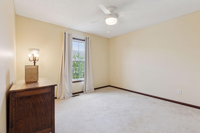 5214 Scott Ct, Robbinsdale, MN 55422 - unfurnished bedroom with light carpet, a ceiling fan, and a textured ceiling