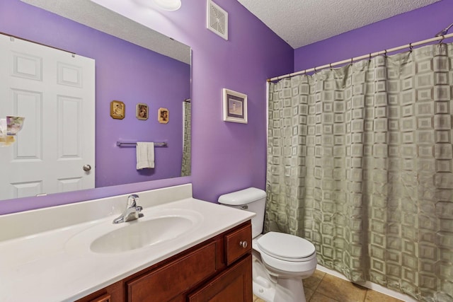 5214 Scott Ct, Robbinsdale, MN 55422 - bathroom with a textured ceiling, vanity, tile patterned flooring, and a shower with shower curtain