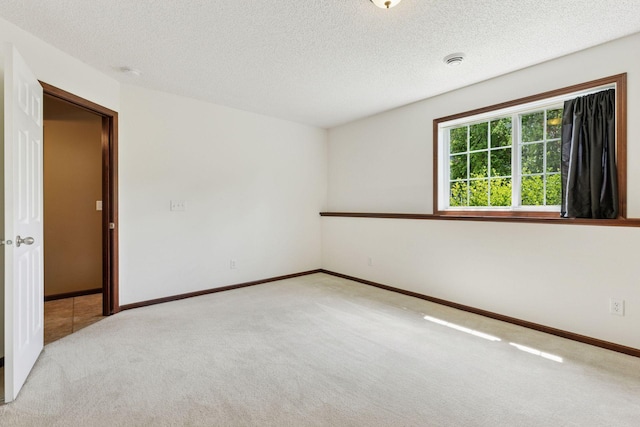 5214 Scott Ct, Robbinsdale, MN 55422 - unfurnished room with carpet flooring, a textured ceiling, and a smoke detector