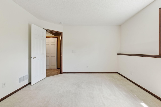 5214 Scott Ct, Robbinsdale, MN 55422 - empty room with light carpet and a textured ceiling