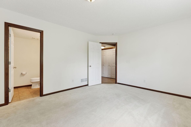 5214 Scott Ct, Robbinsdale, MN 55422 - unfurnished bedroom with carpet flooring and connected bathroom
