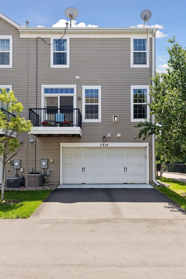 5214 Scott Ct, Robbinsdale, MN 55422 - back of house with a garage and driveway