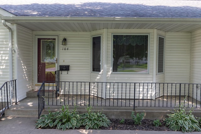 104 County Rd N, Le Roy, MN 55951 - property entrance with a shingled roof
