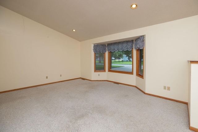 104 County Rd N, Le Roy, MN 55951 - carpeted empty room with vaulted ceiling and recessed lighting
