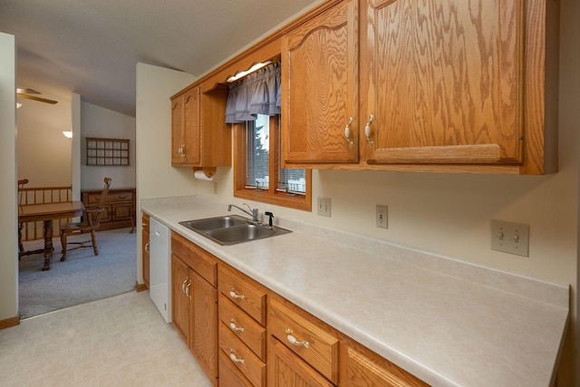 104 County Rd N, Le Roy, MN 55951 - kitchen with dishwasher, light carpet, brown cabinetry, light countertops, and lofted ceiling