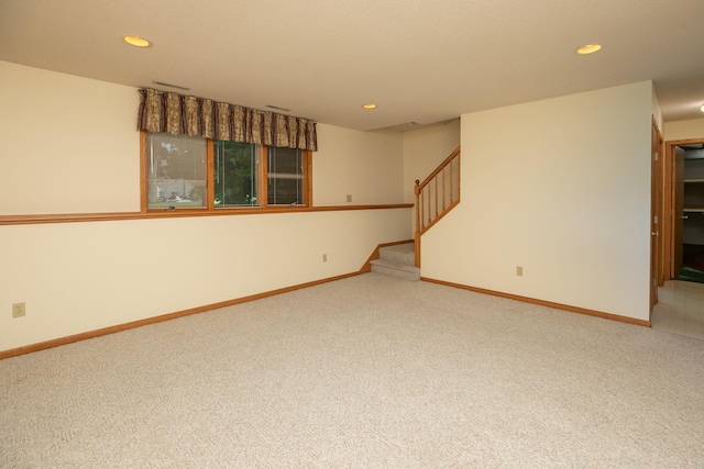 104 County Rd N, Le Roy, MN 55951 - empty room featuring light colored carpet, recessed lighting, and stairs
