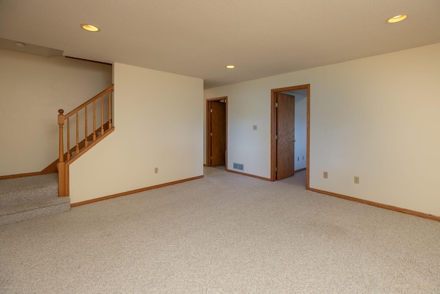 104 County Rd N, Le Roy, MN 55951 - unfurnished room featuring light carpet, recessed lighting, and stairway