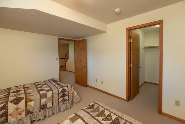 104 County Rd N, Le Roy, MN 55951 - bedroom with light carpet and a walk in closet