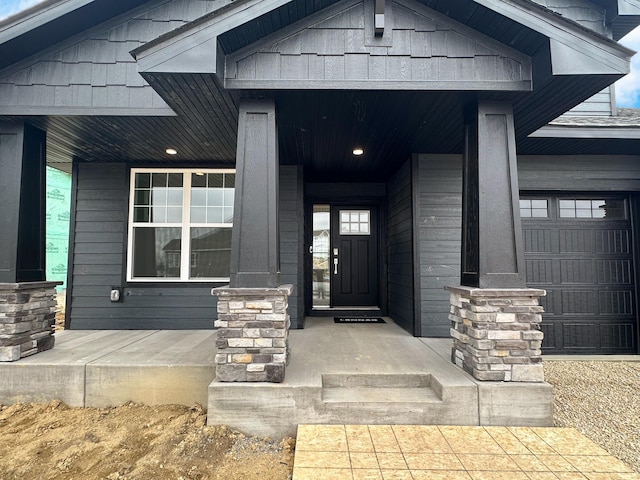 6722 Tamarack Ln, Corcoran, MN 55340 - entrance to property featuring a porch and a garage