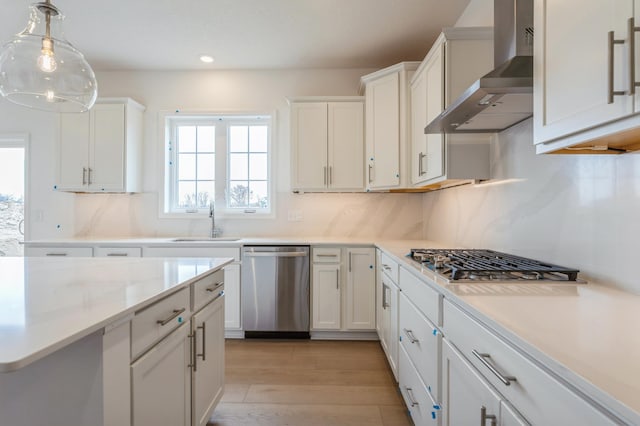 6722 Tamarack Ln, Corcoran, MN 55340 - kitchen with appliances with stainless steel finishes, wall chimney exhaust hood, light countertops, white cabinets, and recessed lighting