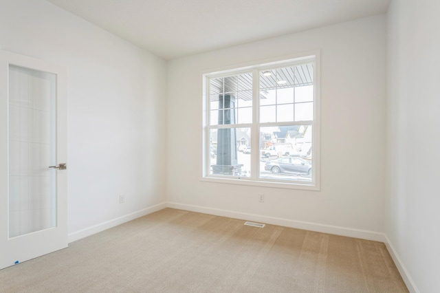 6722 Tamarack Ln, Corcoran, MN 55340 - spare room with light carpet and baseboards