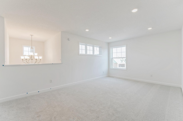 6722 Tamarack Ln, Corcoran, MN 55340 - carpeted spare room with a chandelier and recessed lighting