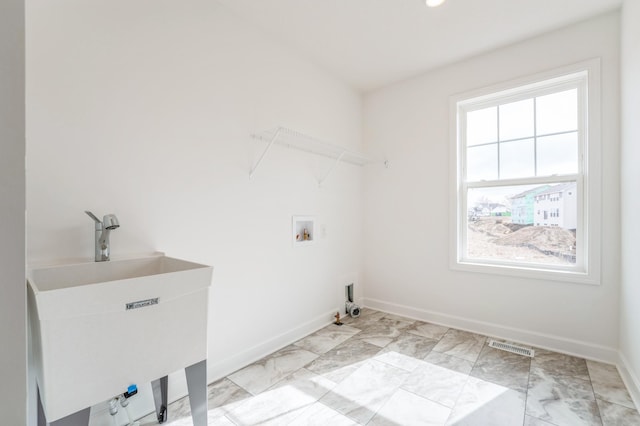 6722 Tamarack Ln, Corcoran, MN 55340 - laundry room with washer hookup, light marble finish flooring, and hookup for a gas dryer