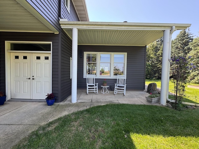 715 250th Ave, Fairmont, MN 56031 - view of exterior entry with a yard and a porch