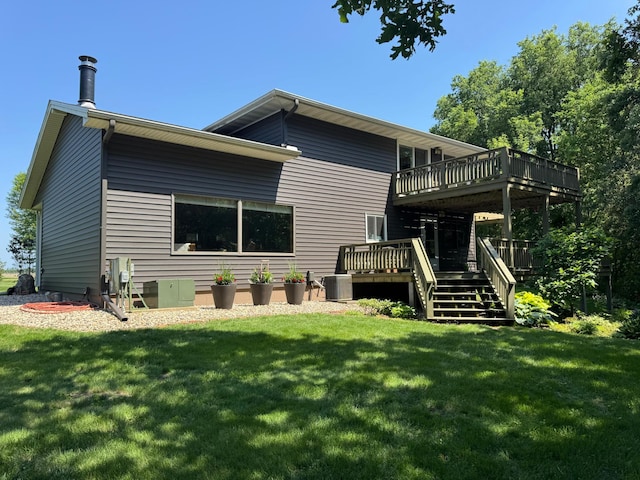715 250th Ave, Fairmont, MN 56031 - rear view of house featuring a wooden deck and a lawn