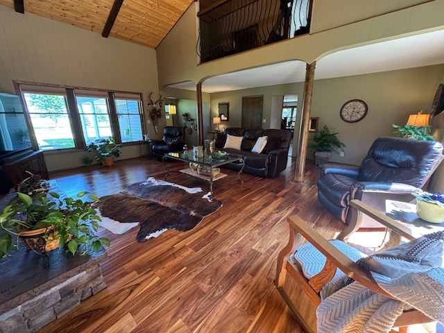715 250th Ave, Fairmont, MN 56031 - living area featuring high vaulted ceiling, ornate columns, wood finished floors, wood walls, and wooden ceiling