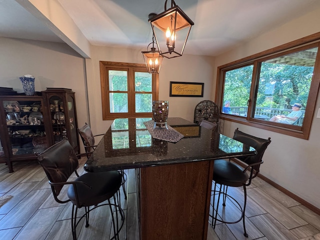 715 250th Ave, Fairmont, MN 56031 - dining area with wood finish floors and a chandelier
