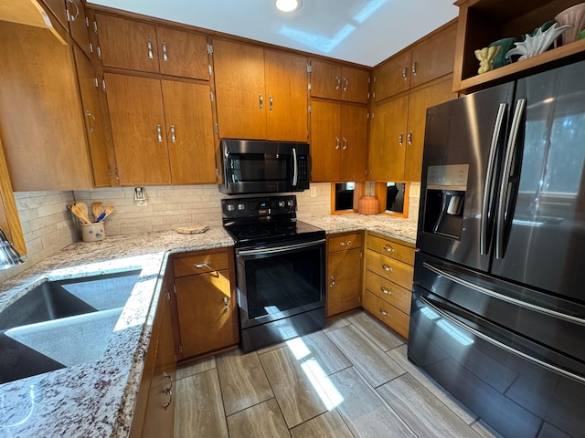 715 250th Ave, Fairmont, MN 56031 - kitchen featuring black appliances, brown cabinets, tasteful backsplash, and recessed lighting