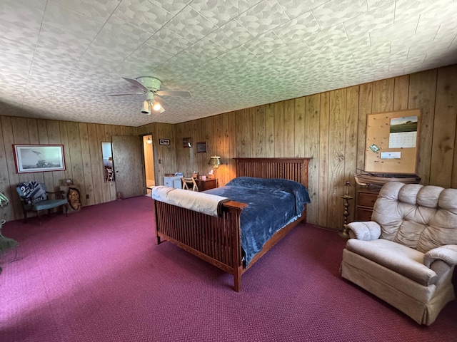 715 250th Ave, Fairmont, MN 56031 - carpeted bedroom featuring wooden walls and a ceiling fan