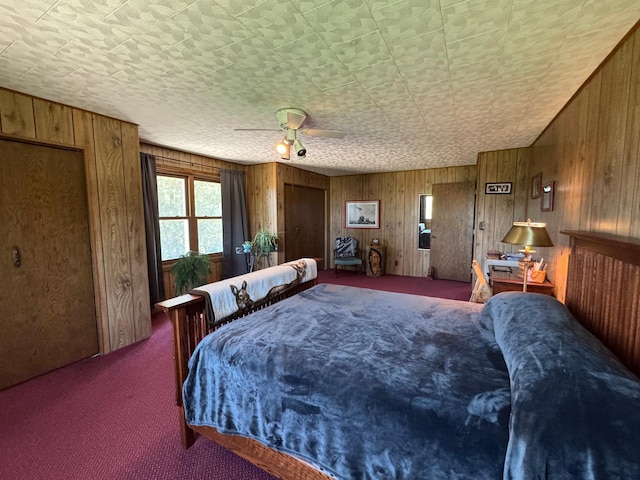 715 250th Ave, Fairmont, MN 56031 - carpeted bedroom with wood walls and a ceiling fan