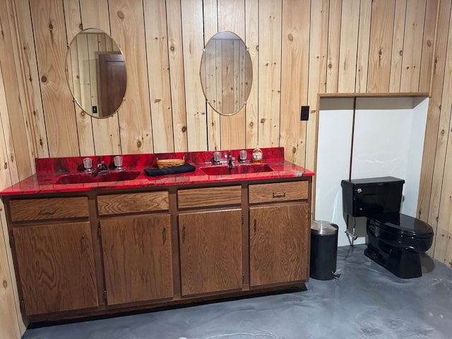 715 250th Ave, Fairmont, MN 56031 - bathroom with wooden walls, double vanity, and concrete floors