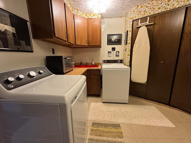 715 250th Ave, Fairmont, MN 56031 - laundry area featuring cabinet space and independent washer and dryer