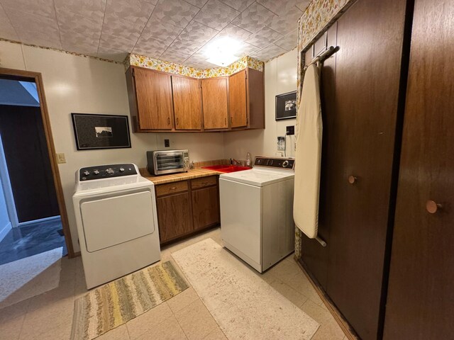 715 250th Ave, Fairmont, MN 56031 - laundry room with washing machine and clothes dryer and cabinet space