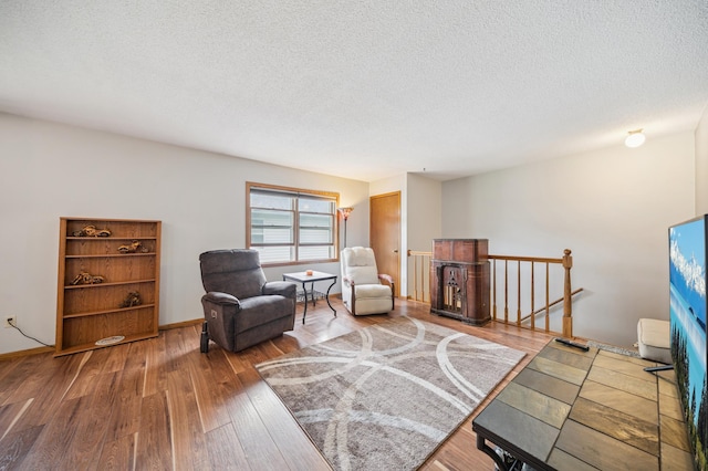 2227 3rd St SW, Rochester, MN 55902 - sitting room featuring an upstairs landing, a textured ceiling, and wood finished floors