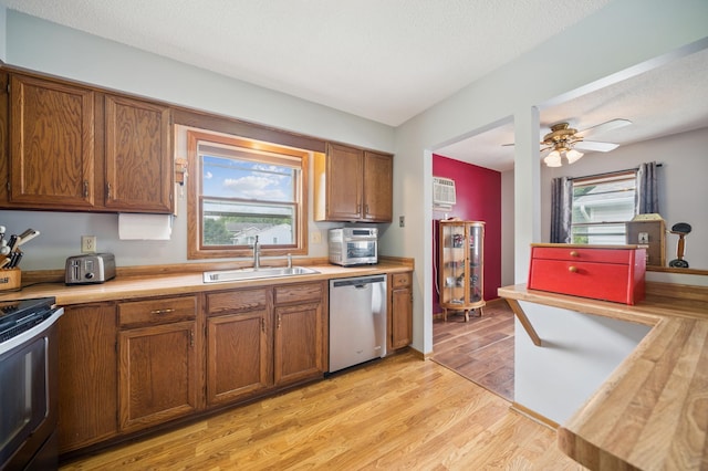 2227 3rd St SW, Rochester, MN 55902 - kitchen featuring appliances with stainless steel finishes, light countertops, and brown cabinets