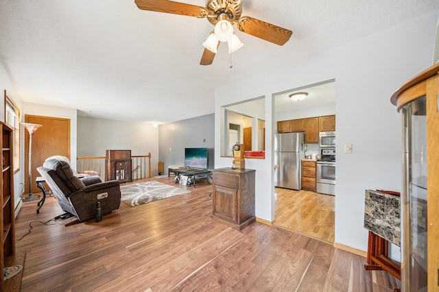 2227 3rd St SW, Rochester, MN 55902 - living room with light wood-style flooring and a ceiling fan