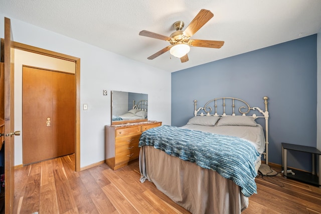 2227 3rd St SW, Rochester, MN 55902 - bedroom with light wood finished floors and a ceiling fan