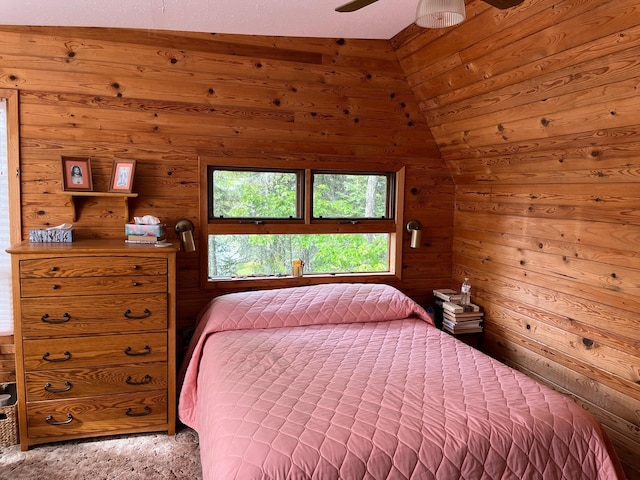 2485 Keyes Is, International Falls, MN 56649 - carpeted bedroom with wooden walls, vaulted ceiling, and ceiling fan